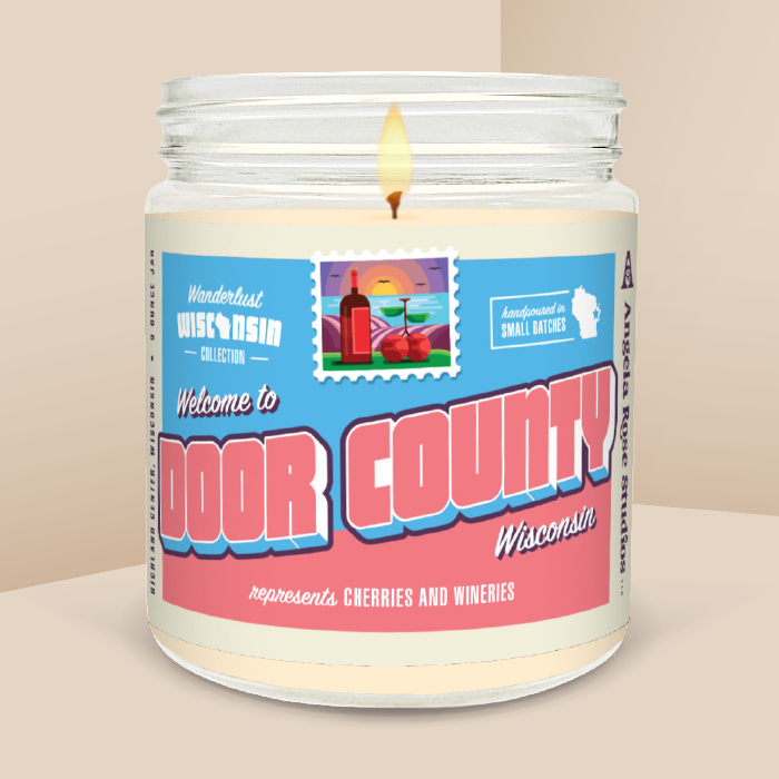 Door County soy candle in a 9 oz glass jar, from the Wanderlust Wisconsin Collection by Angela Rose Studios.