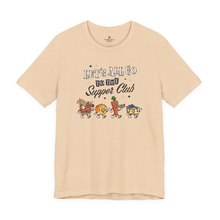Load image into Gallery viewer, Cream unisex t-shirt with ‘Let’s All Go to the Supper Club’ black-and-white text and cartoon characters of a brandy old fashioned, golden dinner roll, relish tray, and blueberry cheesecake.