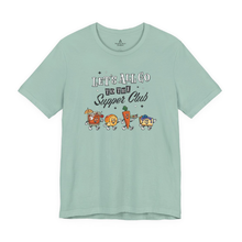 Load image into Gallery viewer, Light green unisex t-shirt with ‘Let’s All Go to the Supper Club’ black-and-white text and cartoon characters of a brandy old fashioned, golden dinner roll, relish tray, and blueberry cheesecake.